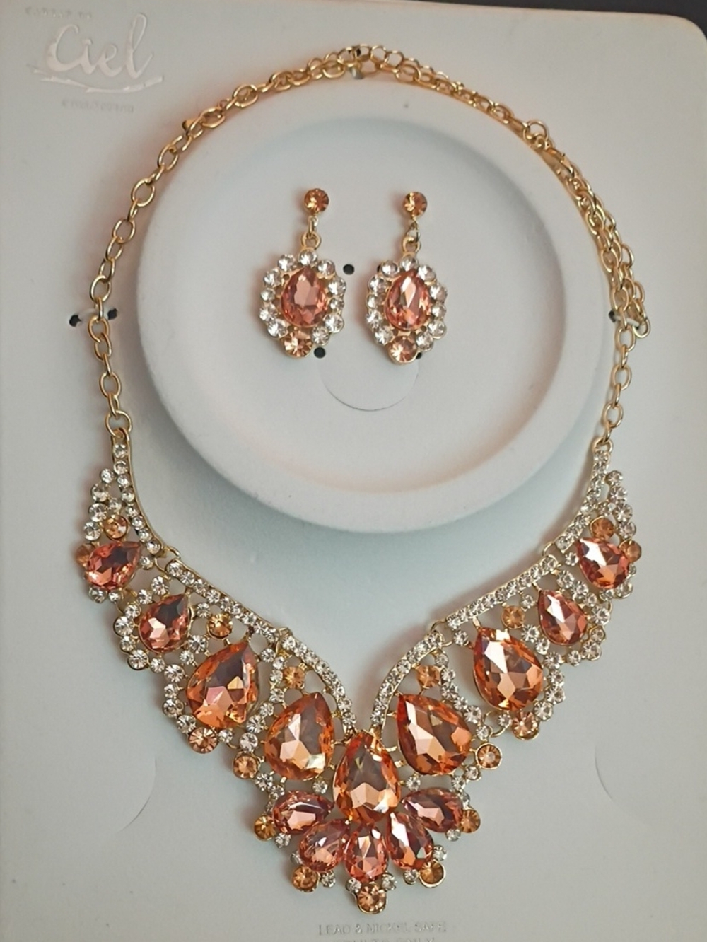 Ciel Gold-Tone Peach Crystal Statement Necklace with Matching Earrings